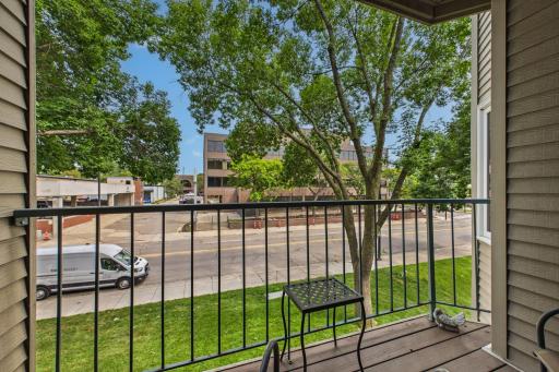 Balcony easily accommodates two chairs and a small table.