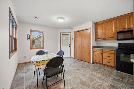 Updated eat in kitchen with plenty of storage. Back door leads to garage and back yard.