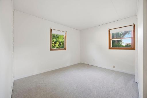 Primary bedroom looking over back yard.