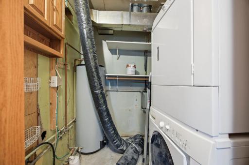 Main floor laundry. Stackable. Main new water meter here as well as the water heater.