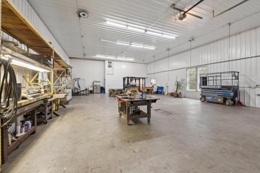 16 ft tall ceilings, heated floors, in-floor drain.