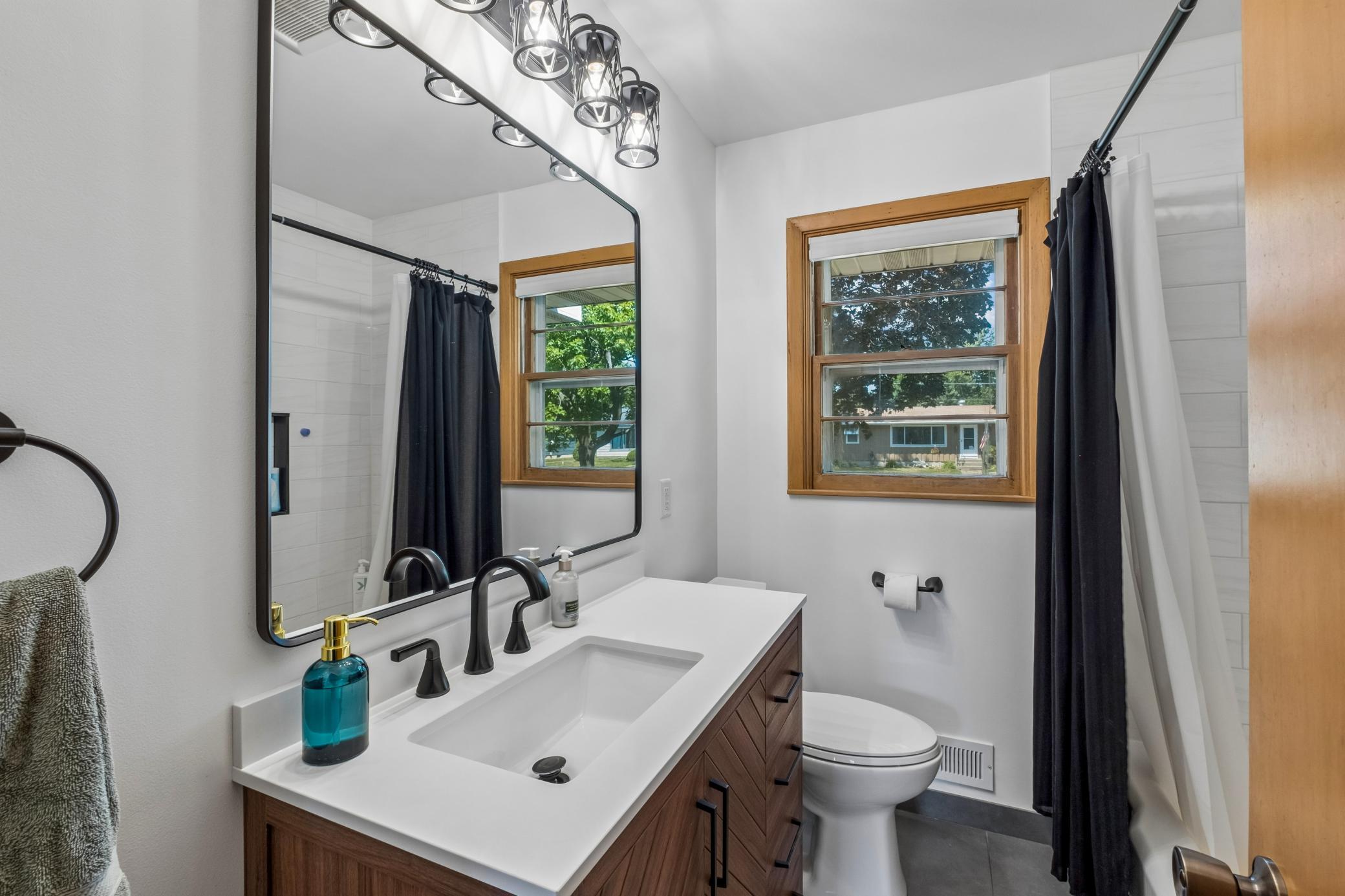 Updated full bath, main floor. Tile shower and floor.