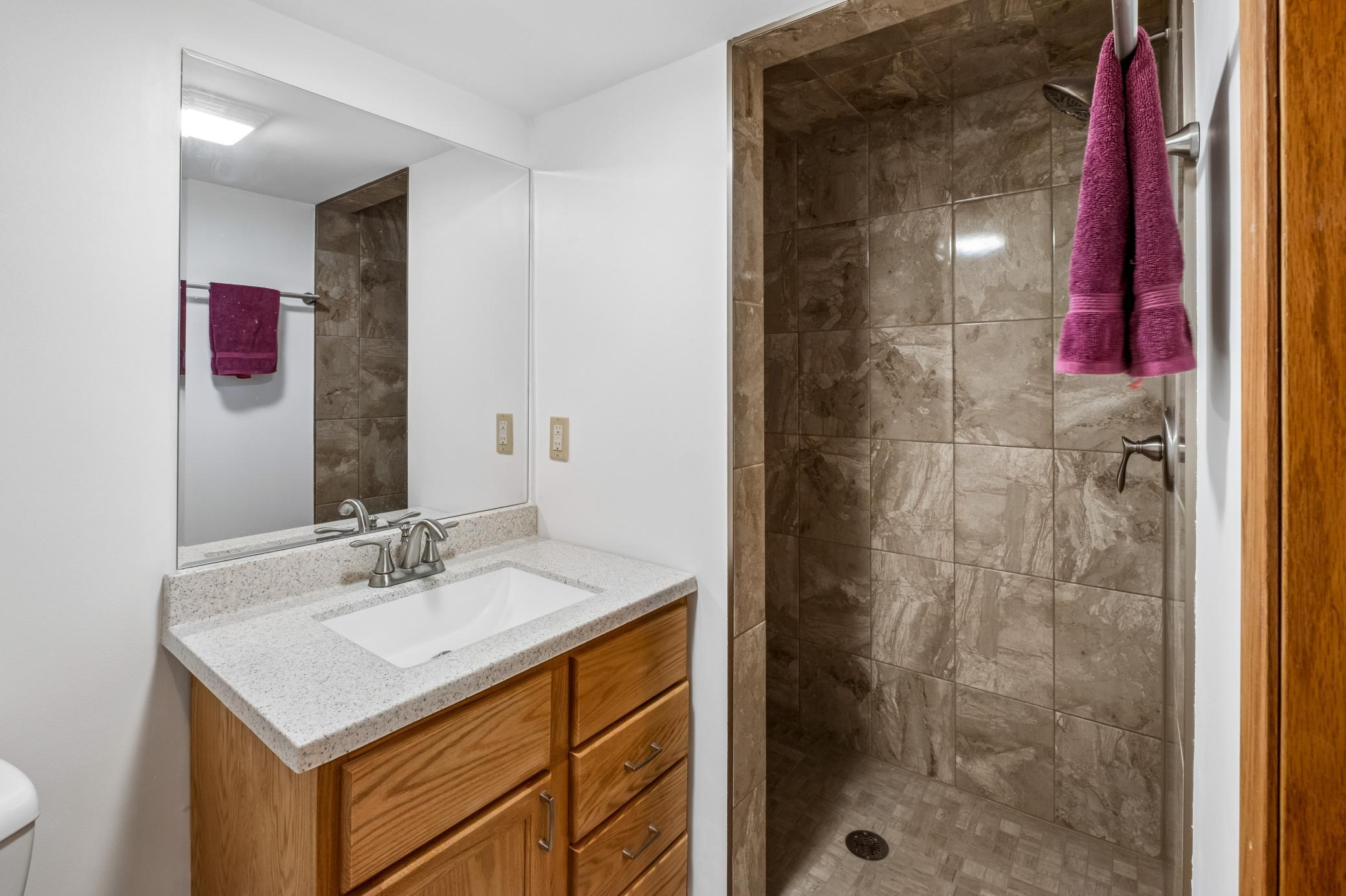 Lower level 3/4 Bath with tile shower.