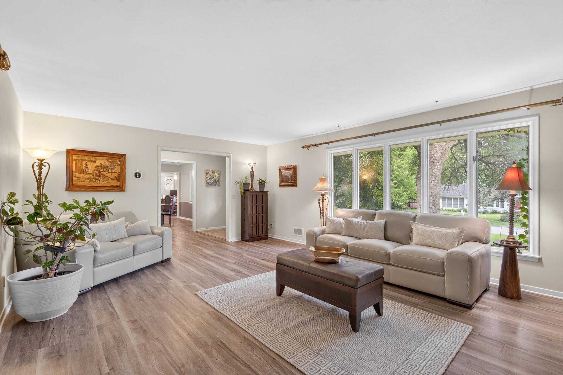 Newer flooring throughout the living/dining/entryway
