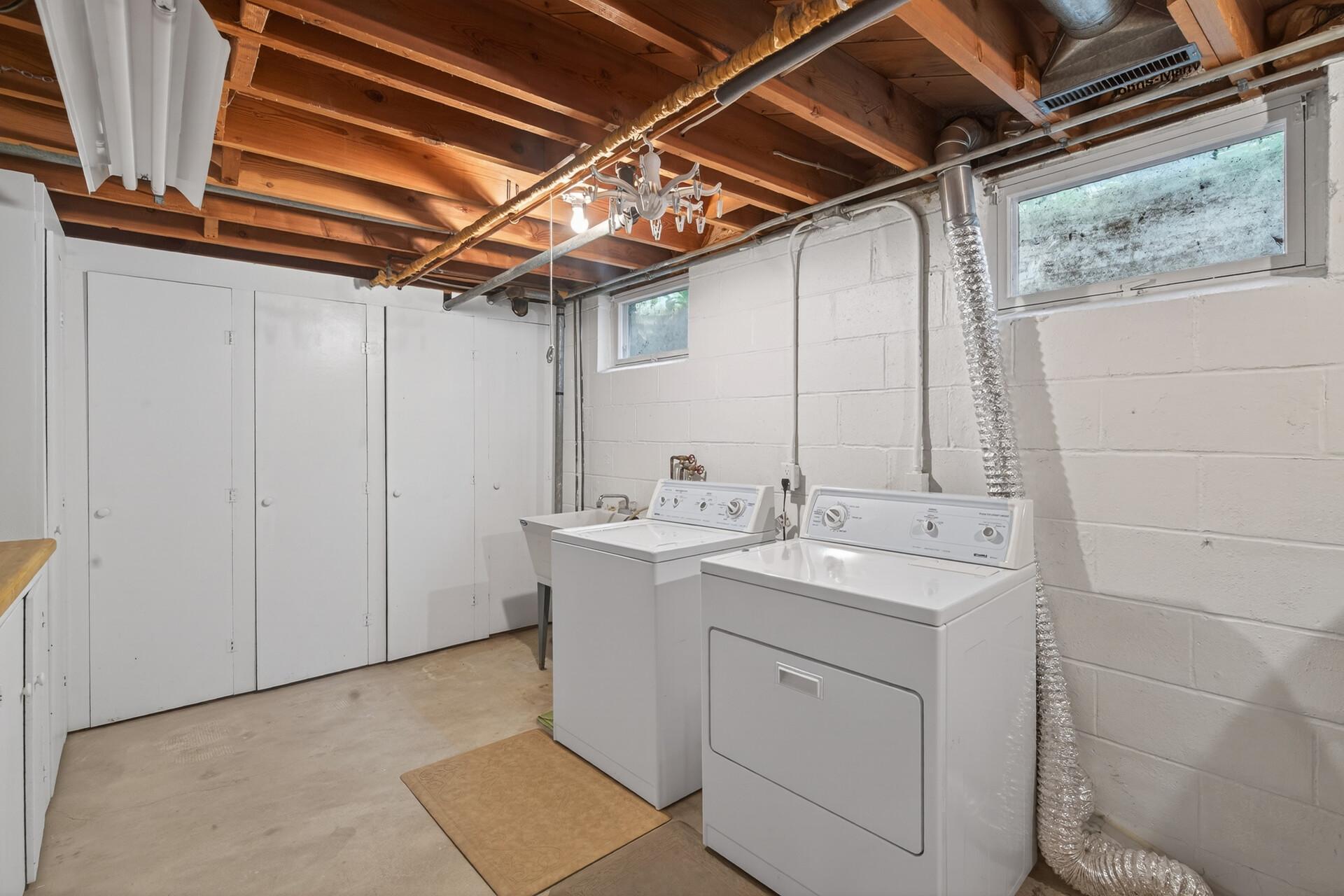 Spacious laundry room with tons of built in storage