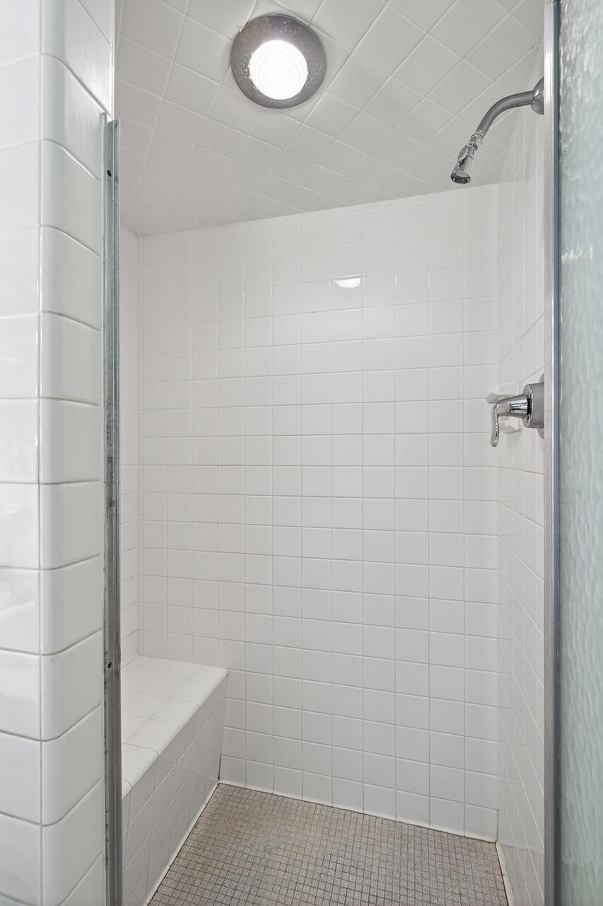 Bedroom #1 ensuite shower with built in tiled bench