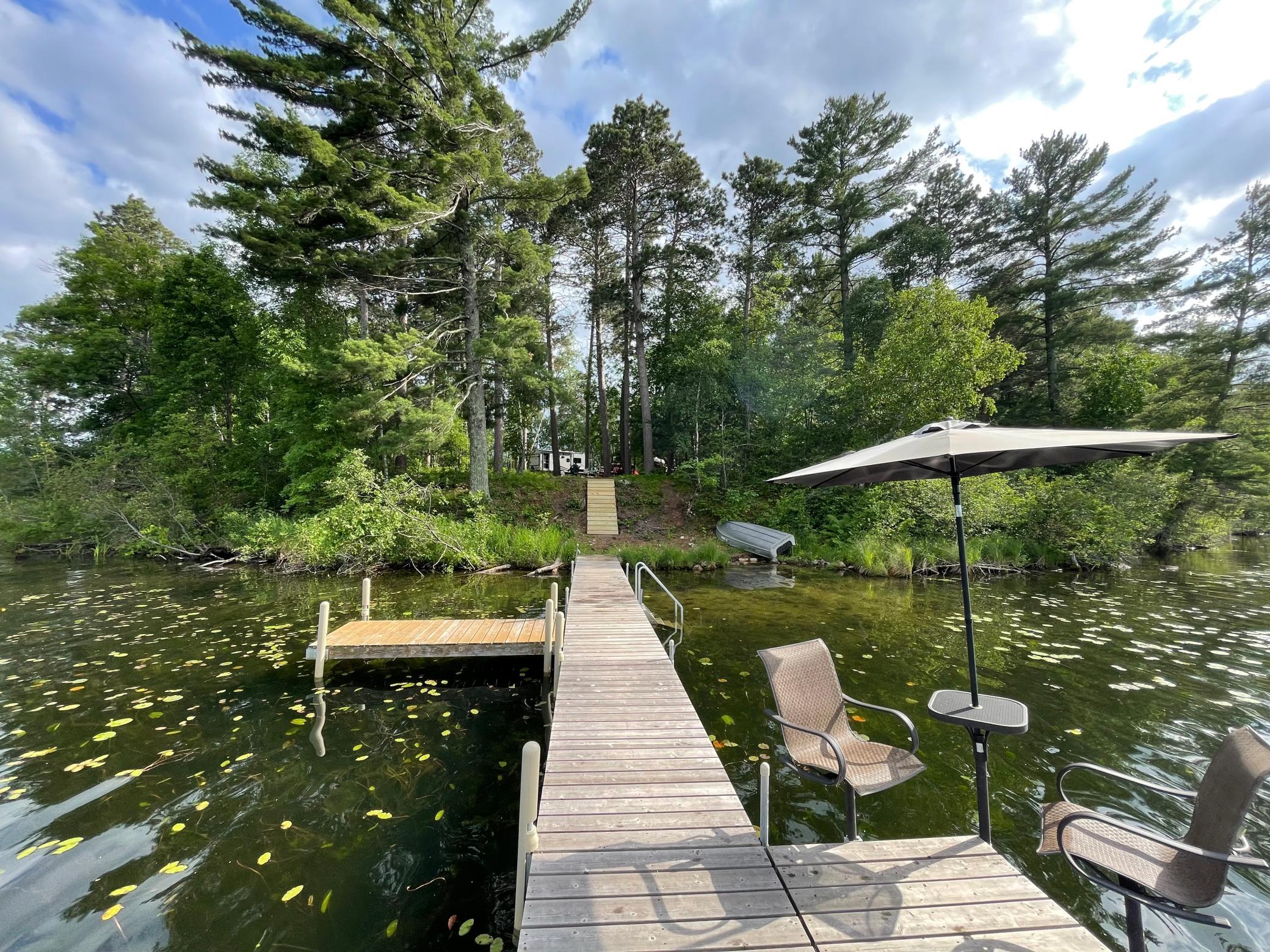 Privacy abounds on one of the most unique lake lots on the market today!