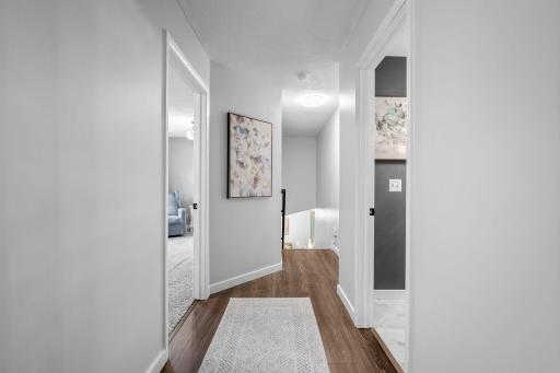 Upstairs welcomes you with white doors, trim, beautiful neutral colors and fresh design, clean spaces!