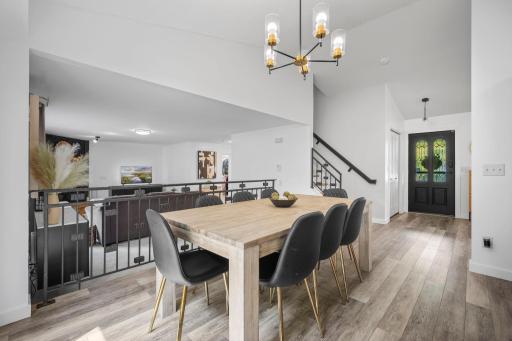 This modified two-story design offers a spacious, open floor plan with excellent flow for both everyday living and entertaining.