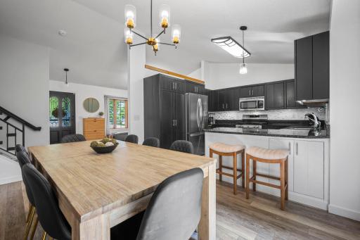 Spacious informal dining! Convenient breakfast bar for easy dining.