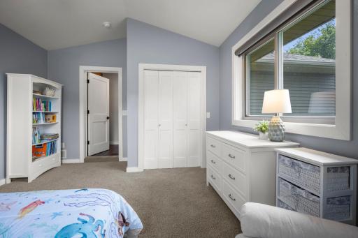 2nd bedroom updates features vaulted ceilings.