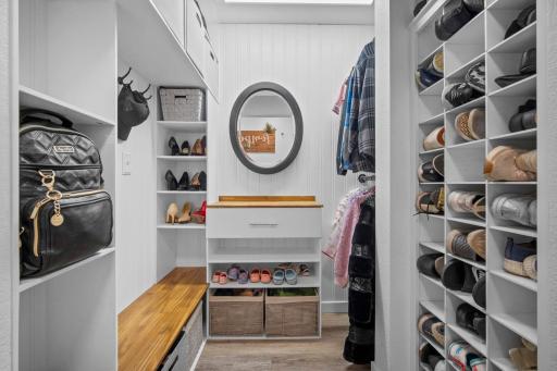 Impressive mudroom with a spacious closet makes staying organized effortless.