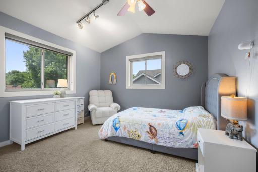 2nd bedroom updates features vaulted ceilings.