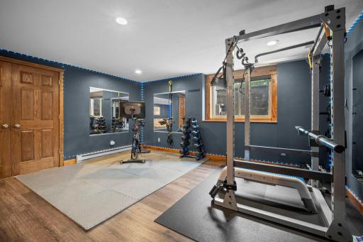 Versatile flex space currently set up as a home exercise nook. Large lookout windows brings in a ton of natural light in this space.