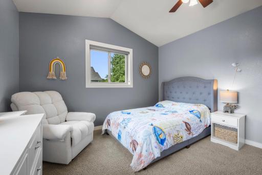 2nd bedroom updates features vaulted ceilings.