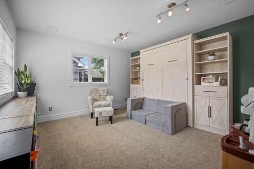 Main level flex room offering double windows that bring in a ton of natural light. Incredible flex space or future 5th bedroom.
