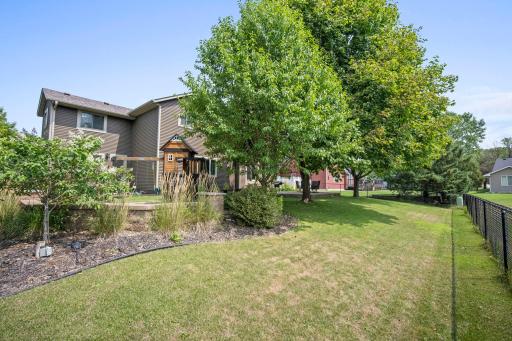 Lovely, fenced backyard retreat with beautifully landscaped outdoor spaces.