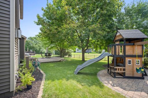 Lovely, fenced backyard retreat with beautifully landscaped outdoor spaces.