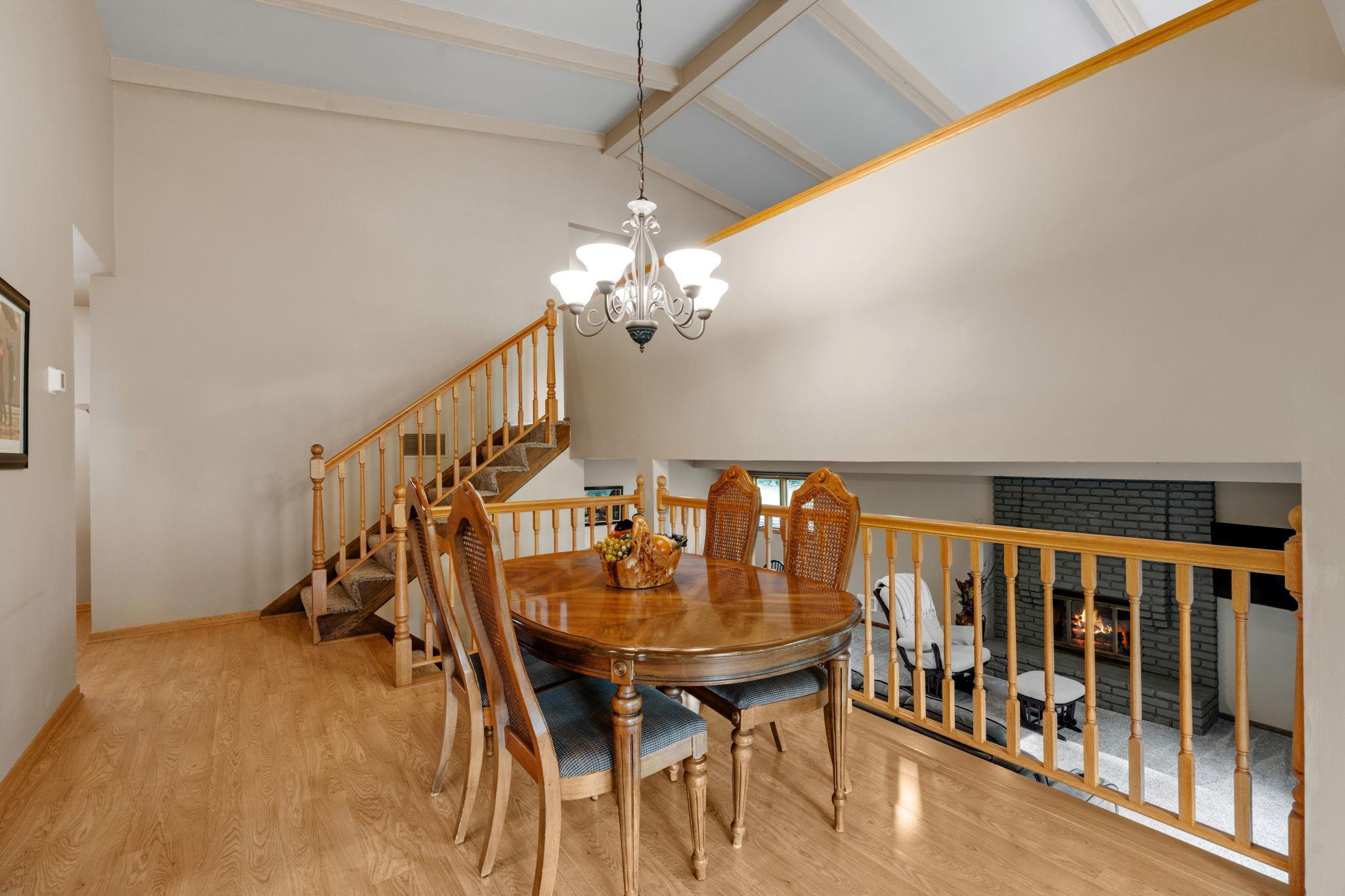 The three-level split layout makes this home functional and full of natural light, while the vaulted ceilings with wood beams bring it all together.
