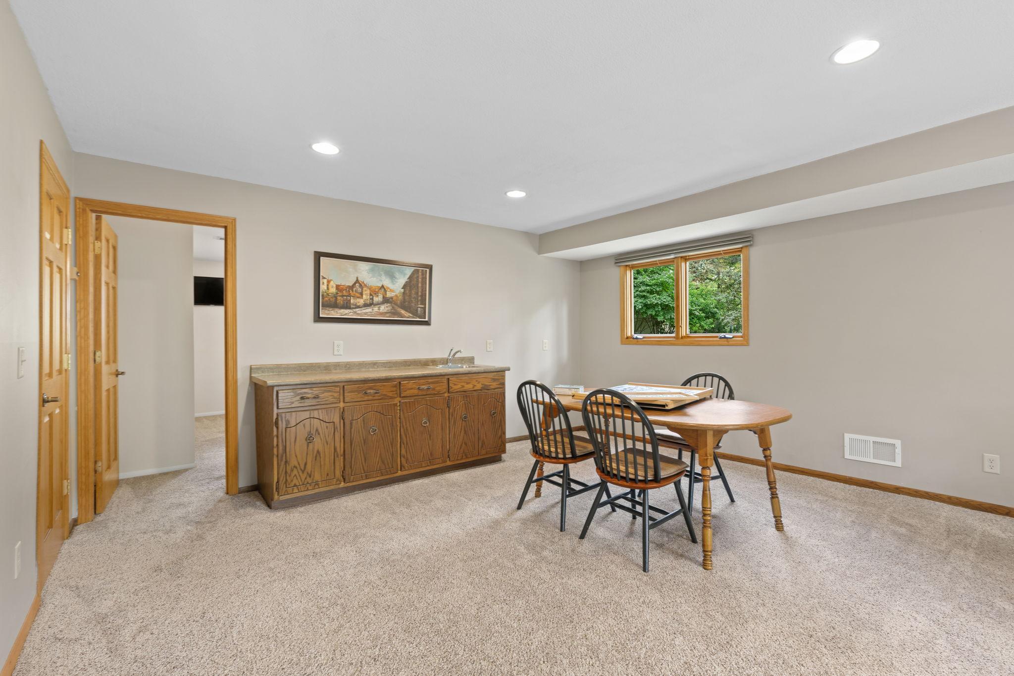 The walkout lower level has so much to offer! More living space, a wet bar, fireplace, 4th bedroom, 3/4 bathroom, and storage coming out your ears!