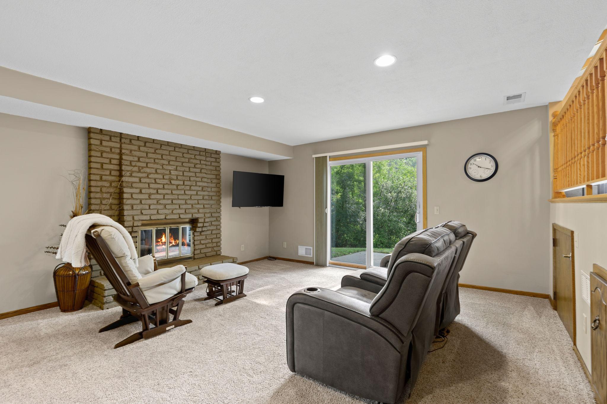 The walkout lower level has so much to offer! More living space, a wet bar, fireplace, 4th bedroom, 3/4 bathroom, and storage coming out your ears!