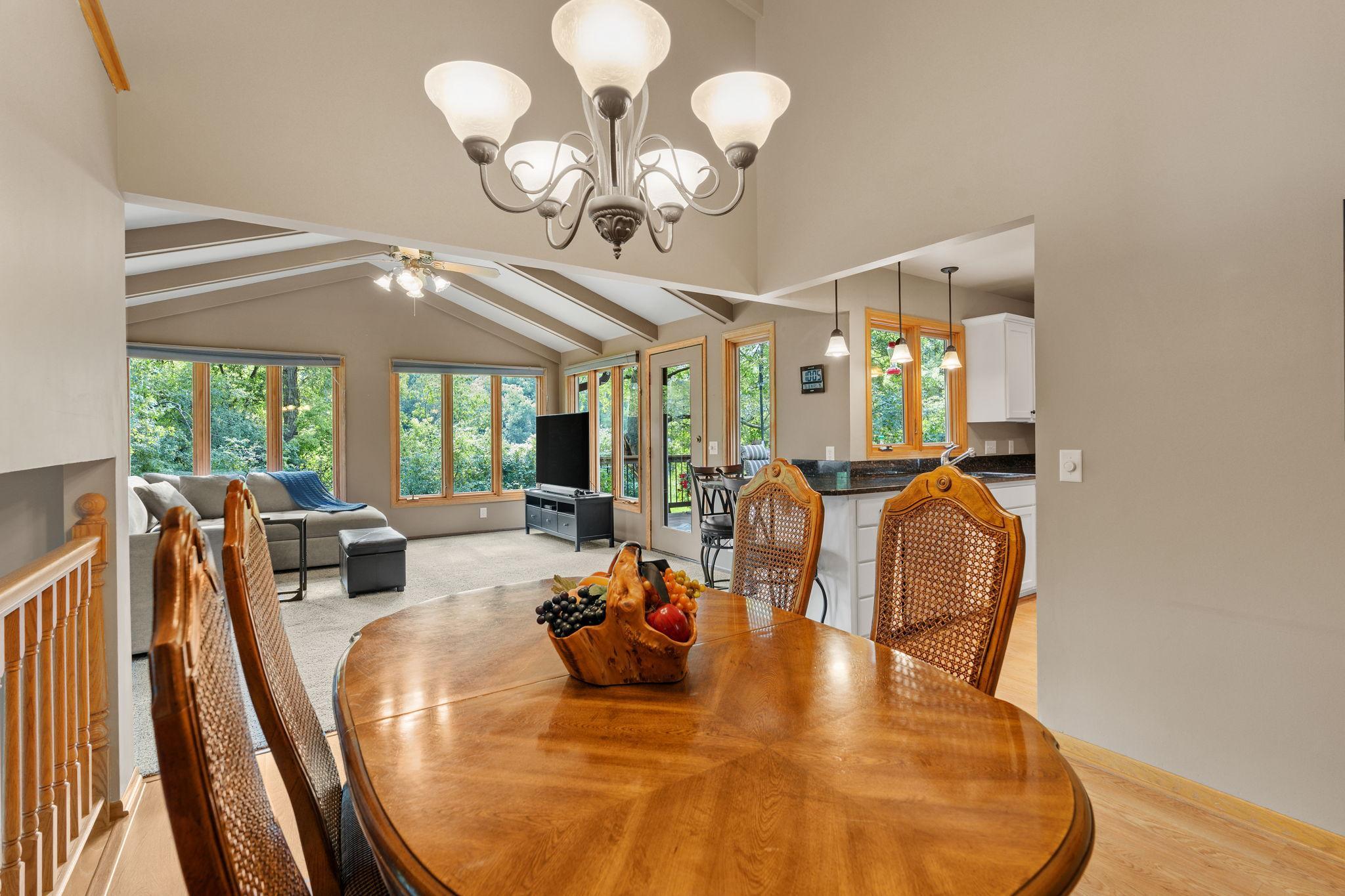 The three-level split layout makes this home functional and full of natural light, while the vaulted ceilings with wood beams bring it all together.