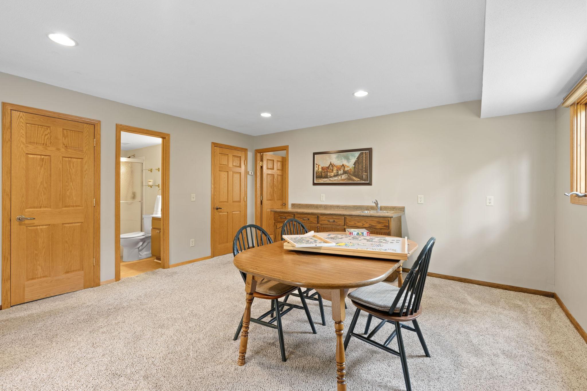The walkout lower level has so much to offer! More living space, a wet bar, fireplace, 4th bedroom, 3/4 bathroom, and storage coming out your ears!