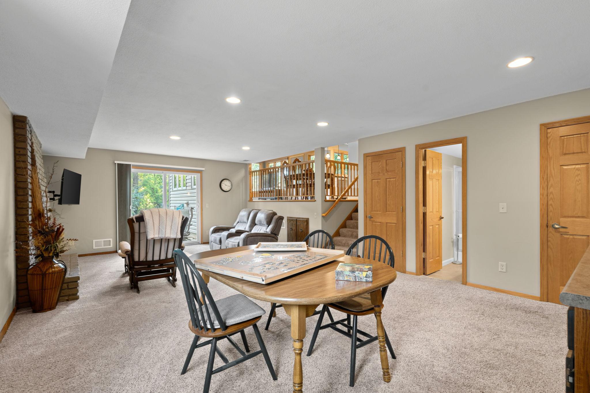 The walkout lower level has so much to offer! More living space, a wet bar, fireplace, 4th bedroom, 3/4 bathroom, and storage coming out your ears!