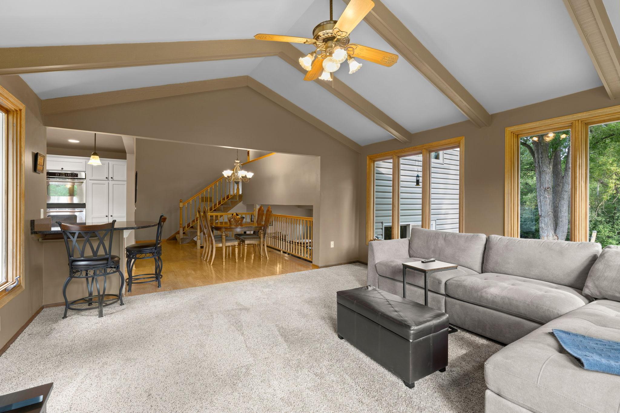 This 4-season porch really makes this home exceptional! The added space and natural light are wonderful, and it helps make the outdoor space and wraparound deck feel like an extension of the home.