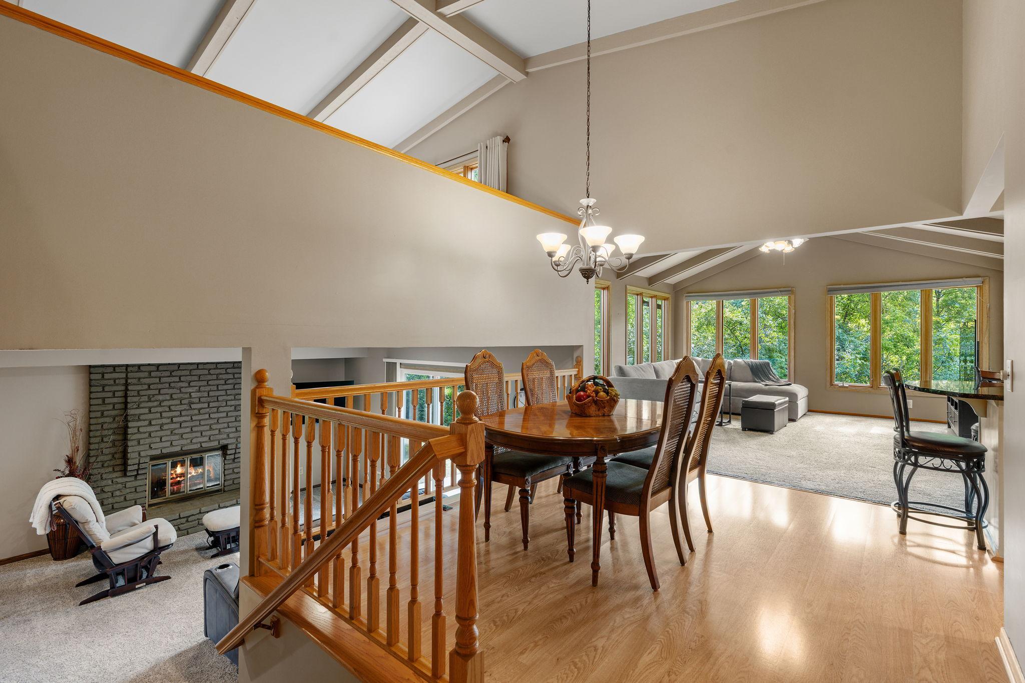 The three-level split layout makes this home functional and full of natural light, while the vaulted ceilings with wood beams bring it all together.