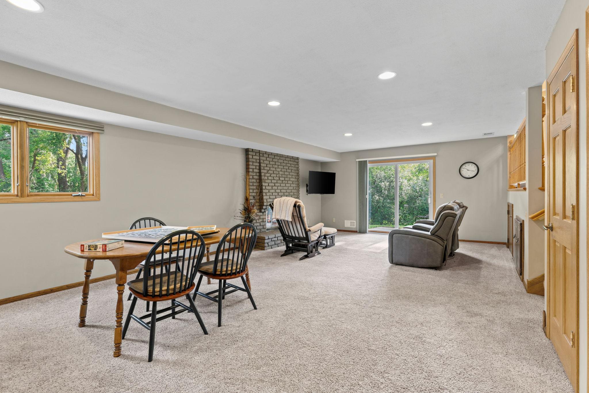 The walkout lower level has so much to offer! More living space, a wet bar, fireplace, 4th bedroom, 3/4 bathroom, and storage coming out your ears!