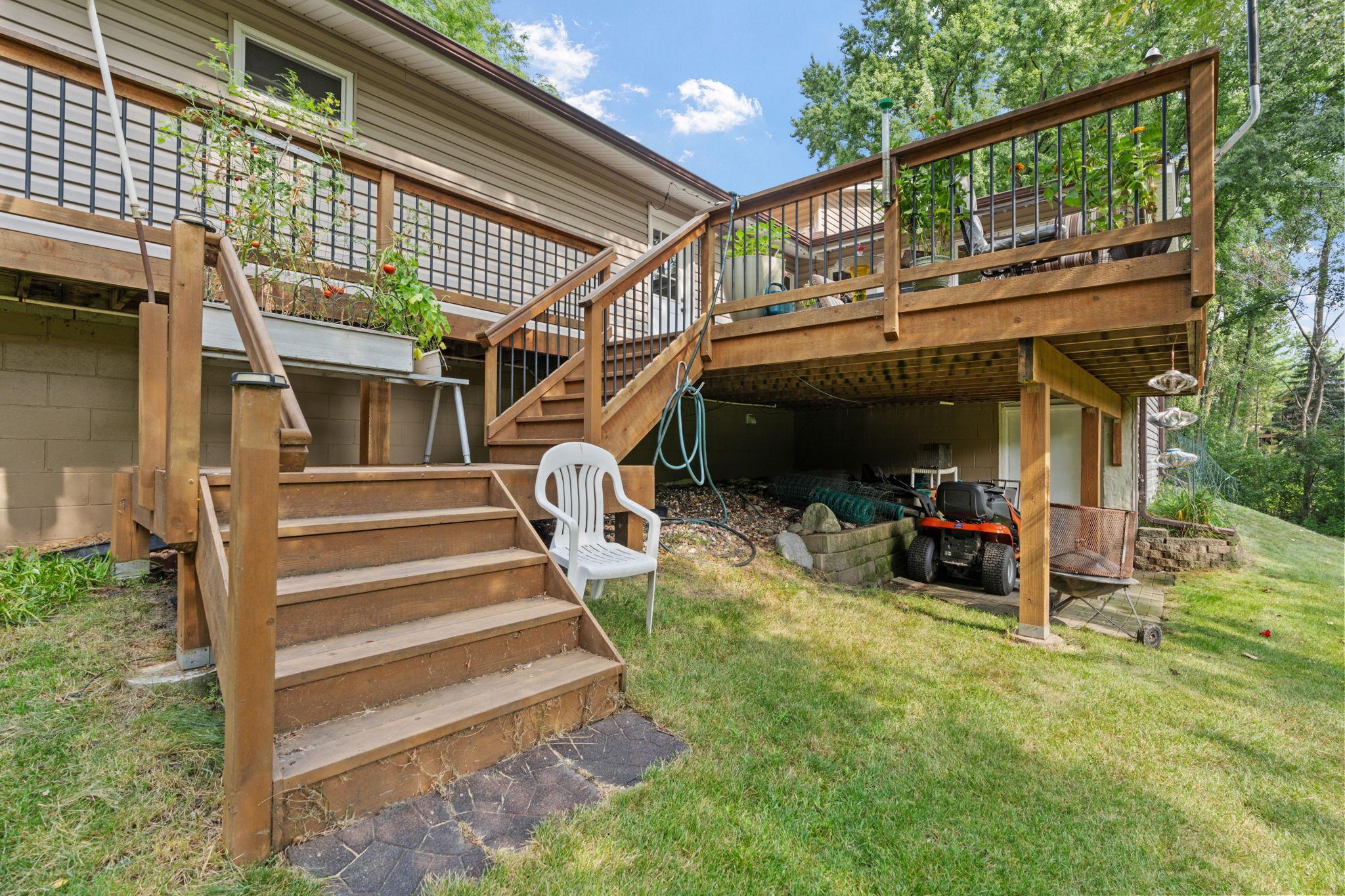A beautiful deck in great condition overlooks the backyard and wraps around to the garage and driveway, adding extra convenience.