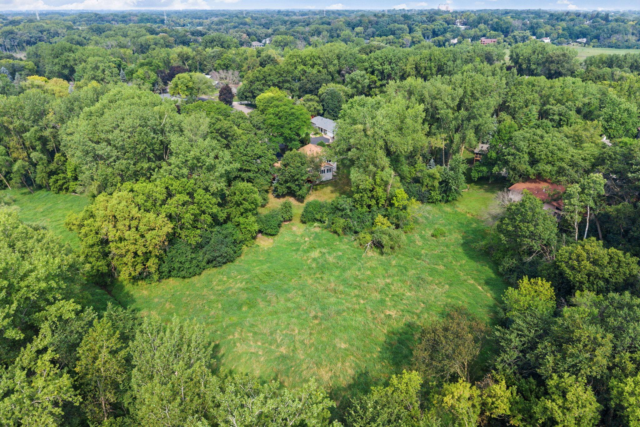The huge backyard backs to 2+ acres of wetlands and 1.25+ acres of city land, complete with a creek and plenty of wildlife.