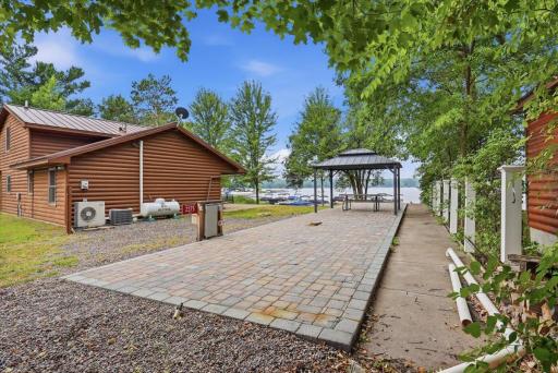 Paver patio set up for you to park your vehicle of choice.