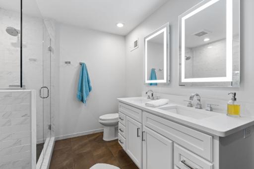 The updated ensuite bathroom (updated 2017) offers a relaxing escape.