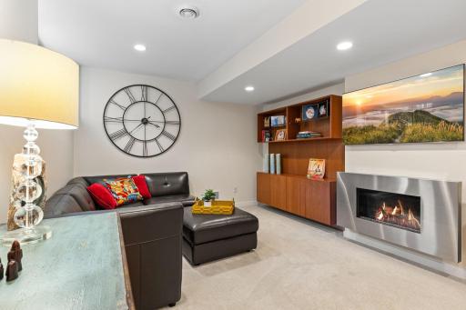 The finished lower level adds an entirely different feel with a custom-designed entertainment space.