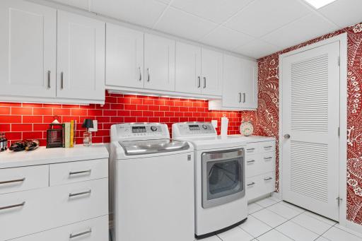 The generously sized lower-level laundry space adds even more functionality with durable tile flooring, abundant cabinetry, and plenty of closet storage.
