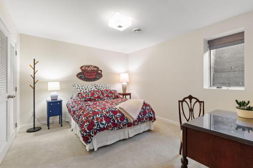 The fourth bedroom, accessed through French doors, provides excellent flexibility for guests, a home office, or a private retreat.