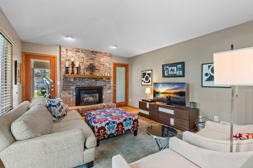 A beautiful floor-to-ceiling brick fireplace anchors the space.