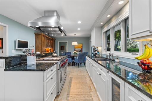 Designed for those who love to cook and entertain, it features stainless steel appliances including a high-end Wolf range.