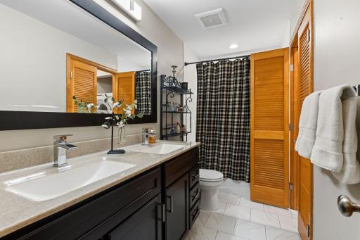 The additional upper-level bathroom has also been updated (2017) and includes tile flooring, a tub/shower combination, a conveniently located laundry area and hall storage.