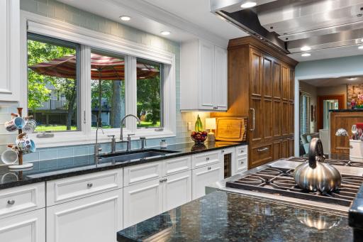 Two-tone cabinetry, soft-close drawers, and designated beverage fridge!