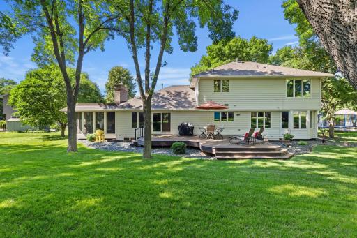 Additional improvements include a new patio door (2023), new roof (2022), leaf guard gutters, new chimney (2026), and privacy tint windows throughout select main living areas and the primary suite.