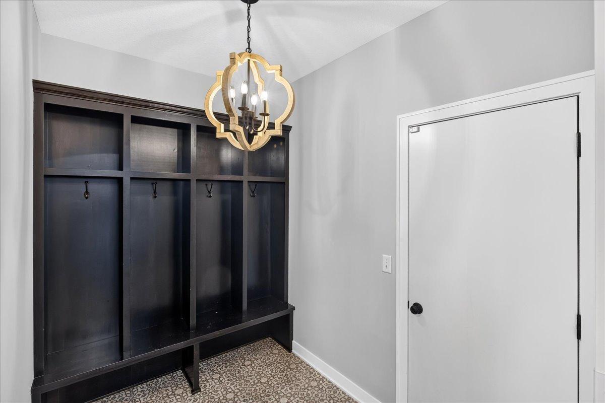 Knotty alder lockers are perfectly located off the garage service door.