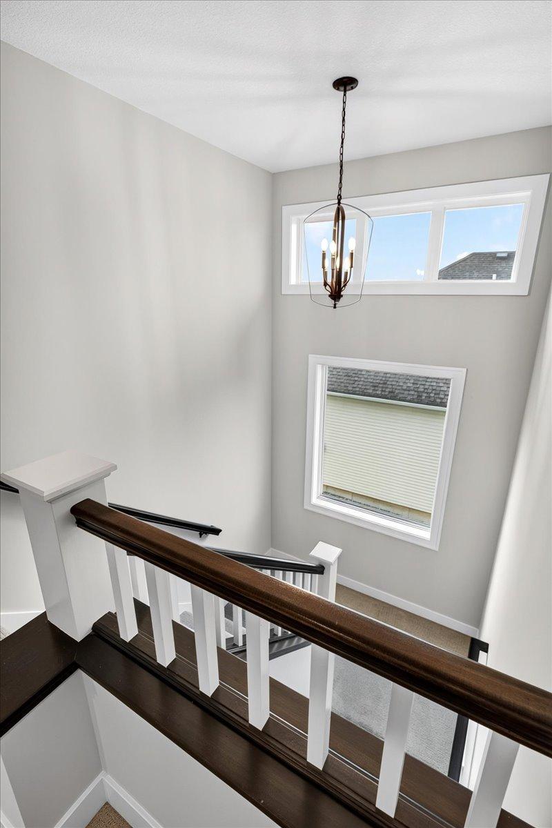 Dramatic staircase w/large windows
