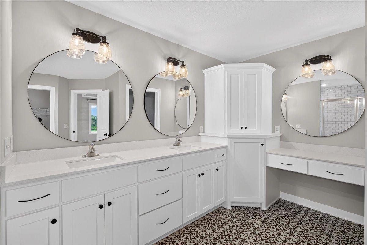 Enameled 36" vanities, corner linen and a make-up counter.