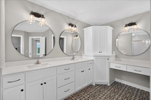 Enameled 36" vanities, corner linen and a make-up counter.