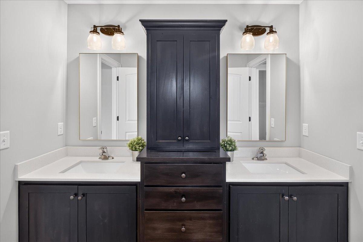 Separate tub/shower/toilet is divided by a pocket door to allow for multple users