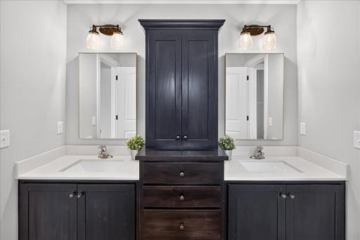 Separate tub/shower/toilet is divided by a pocket door to allow for multple users