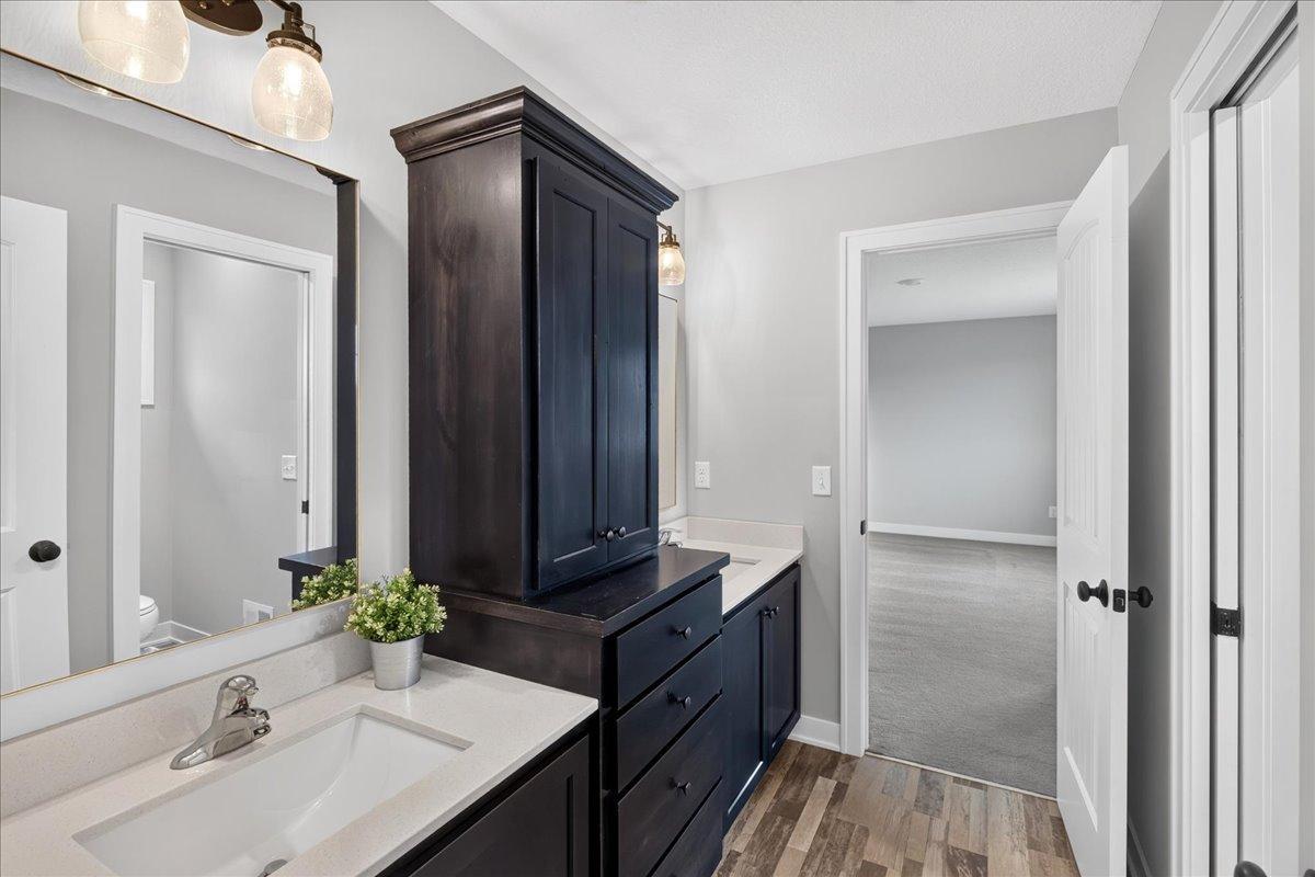 Double quartz vanities w/linen tower